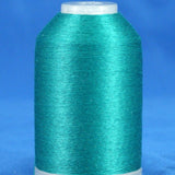 Kent green thread cone on white plastic spool against blue background, showing smooth wound thread surface