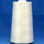 White thread wound on large cone spool against blue background