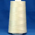 Off white thread wound on large industrial cone spool against blue background