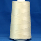 Off white thread wound on large industrial cone spool against blue background