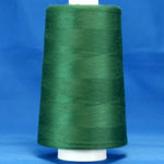 Forest green thread on white cone spool against blue background