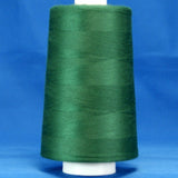 Forest green thread on white cone spool against blue background