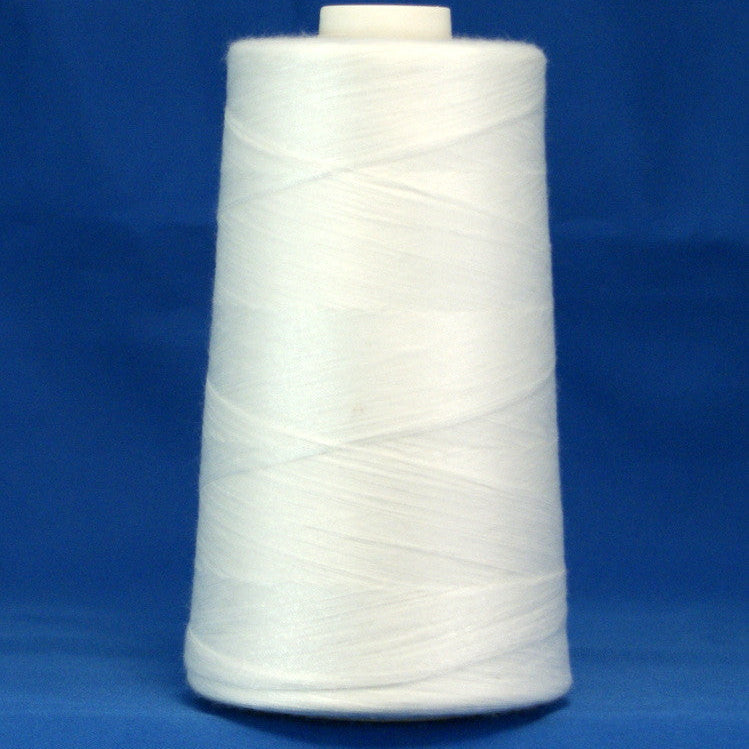 White thread wound on conical spool against blue background