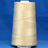 Khaki thread cone with beige-colored thread wound on white plastic spool against blue background