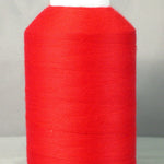 Bright red thread wound on white plastic cone spool against neutral background