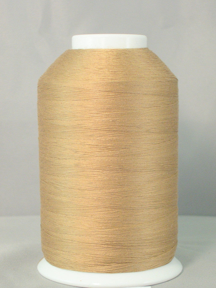 Large cone of light brown thread on white spool against gray background