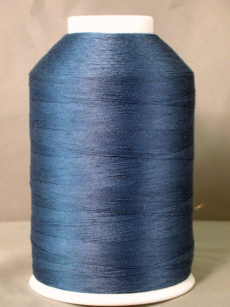 Grey blue thread on white cone spool for sewing and embroidery