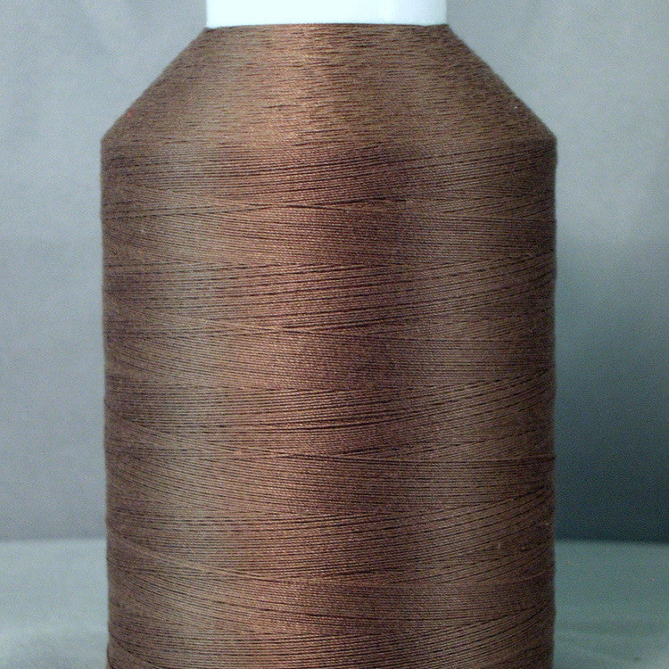 Dark taupe thread wound on white plastic cone spool