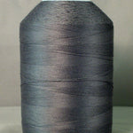 Gray thread cone on white spool for sewing and quilting