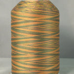 Variegated thread cone in green to tan colors on white spool