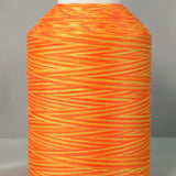 Bright orange and yellow variegated quilting thread wound on white plastic cone with smooth, even texture