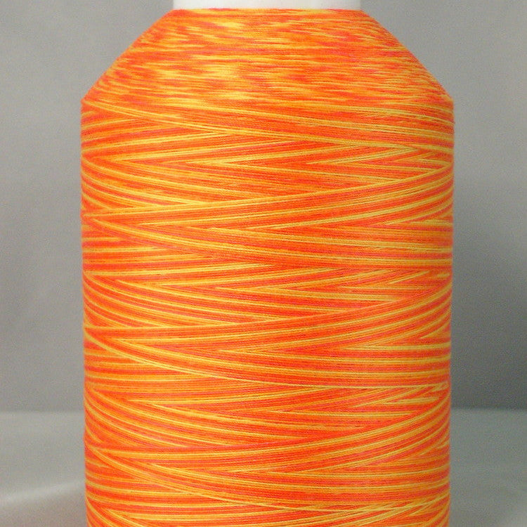 Bright orange and yellow variegated quilting thread wound on white plastic cone with smooth, even texture