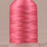 Shocking pink rayon thread wound on mini cone spool with pale pink top and bottom caps