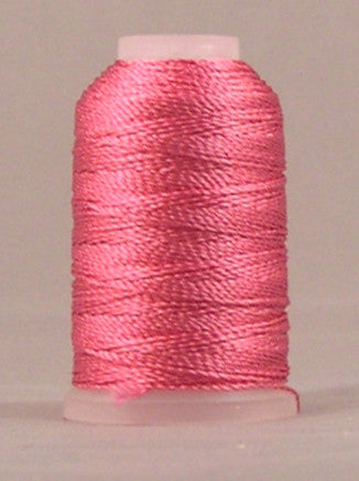 Shocking pink rayon thread wound on mini cone spool with pale pink top and bottom caps