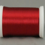 Wine red rayon thread on white plastic spool, showing smooth lustrous finish and even wind