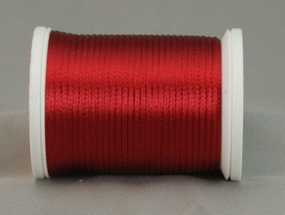 Wine red rayon thread on white plastic spool, showing smooth lustrous finish and even wind