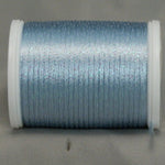 Pale blue metallic thread on white plastic spool with shimmery finish