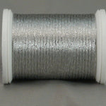 Silver metallic rayon thread on white plastic spool, displaying shimmery finish and smooth winding