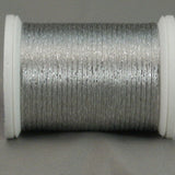 Silver metallic rayon thread on white plastic spool, displaying shimmery finish and smooth winding