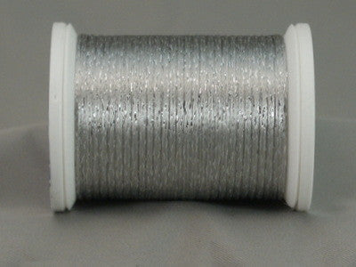 Silver metallic rayon thread on white plastic spool, displaying shimmery finish and smooth winding