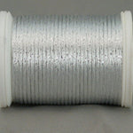 White and silver metallic rayon thread on white plastic spool, showing lustrous finish and tight winding