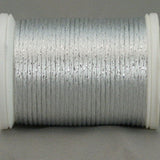 White and silver metallic rayon thread on white plastic spool, showing lustrous finish and tight winding