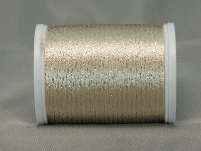 Ecru and gold metallic rayon thread on white plastic spool with shimmery, textured appearance