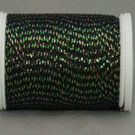 Black thread with iridescent green highlights on white spool, metallic shimmer visible throughout