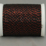 Black thread with red metallic highlights on white plastic spool, creating a textured Night Embers pattern