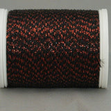 Black thread with red metallic highlights on white plastic spool, creating a textured Night Embers pattern