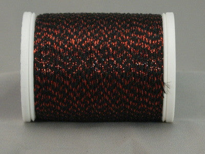 Black thread with red metallic highlights on white plastic spool, creating a textured Night Embers pattern