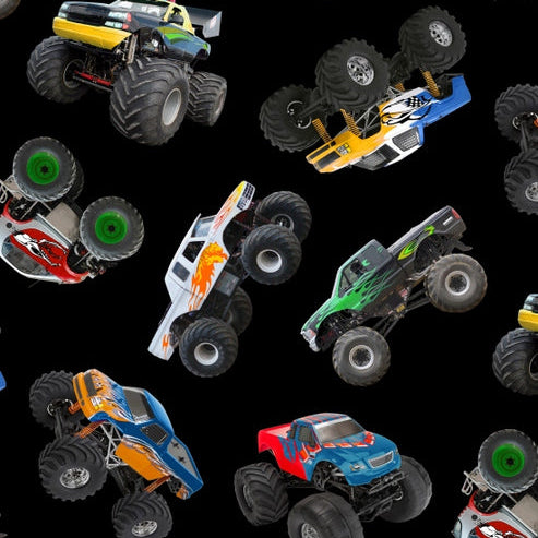 Monster trucks in all shapes and colors against a black background.