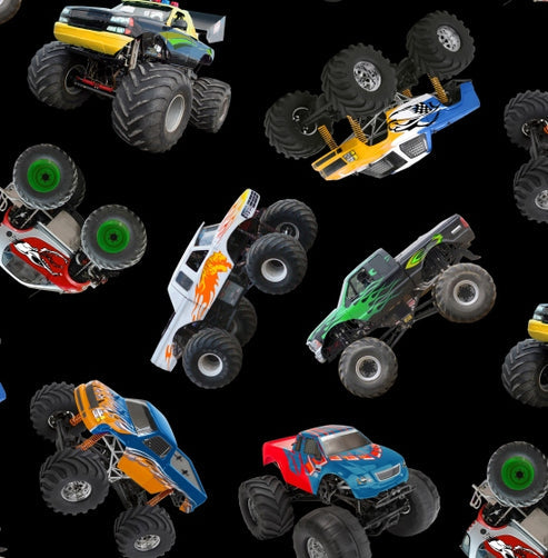 Monster trucks in all shapes and colors against a black background.