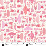 Pink ballet shoes and tutus and leotards on a soft white backgrou