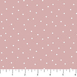 Pink background with scattered white dots.