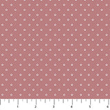 Pink background with cream colored stars in neat rows.