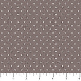 Brown background with cream colored stars in neat rows.