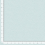 Light blue background with soft dots.