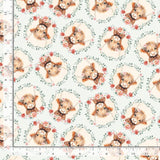 Light blue background with cow faces surrounded by flowers.