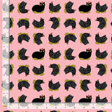Black and white spotted chickens, sitting peacefully on their nes