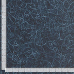 Dark blue tonal batik with wandering lines crisscrossing.