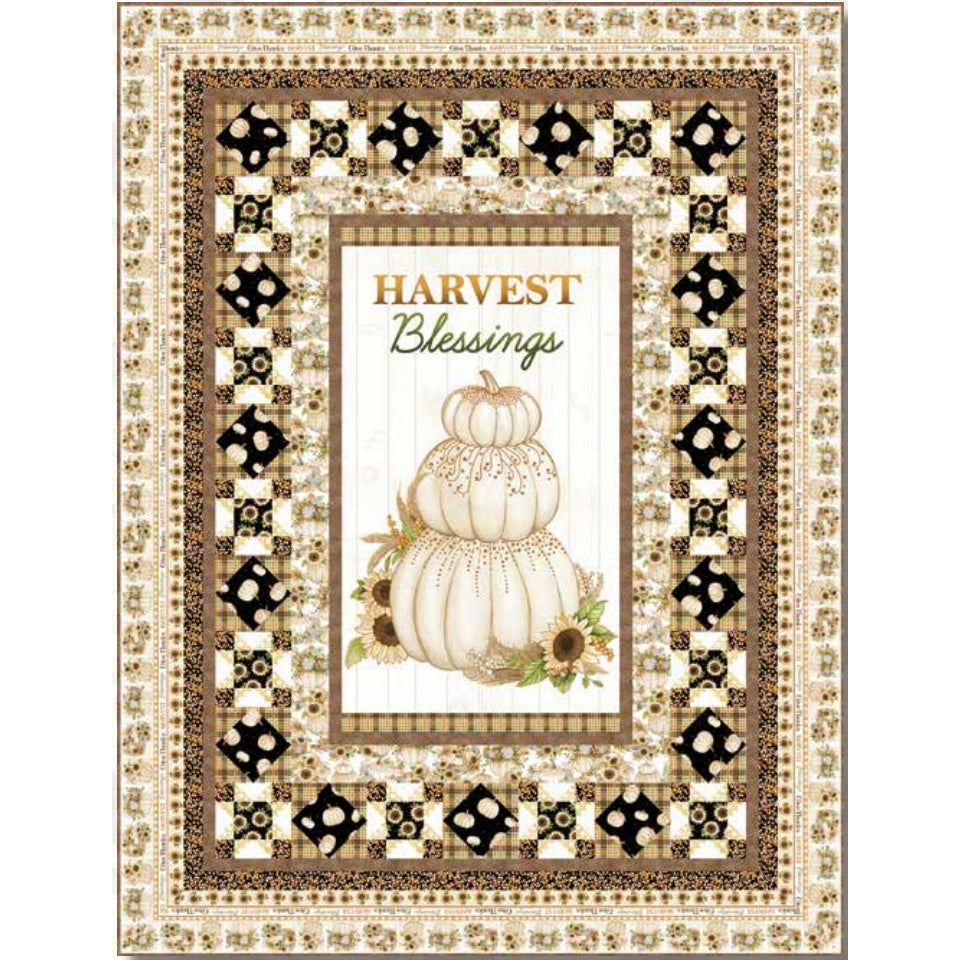 A decorative quilt featuring a "Harvest Blessings" panel with stacked white pumpkins surrounded by geometric black and gold patterned borders.