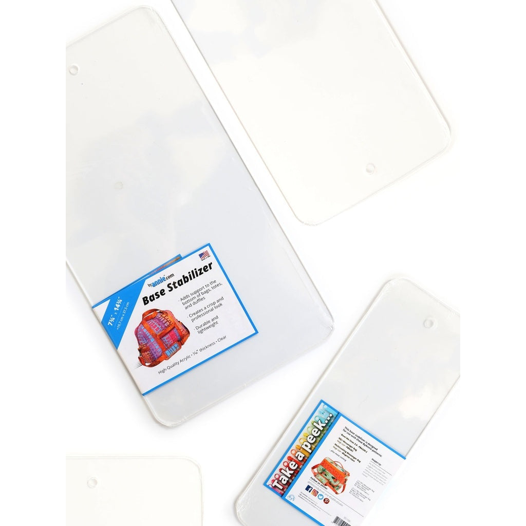 Clear acrylic base stabilizers with blue and white product labels, showing transparent rectangular plates in various sizes.