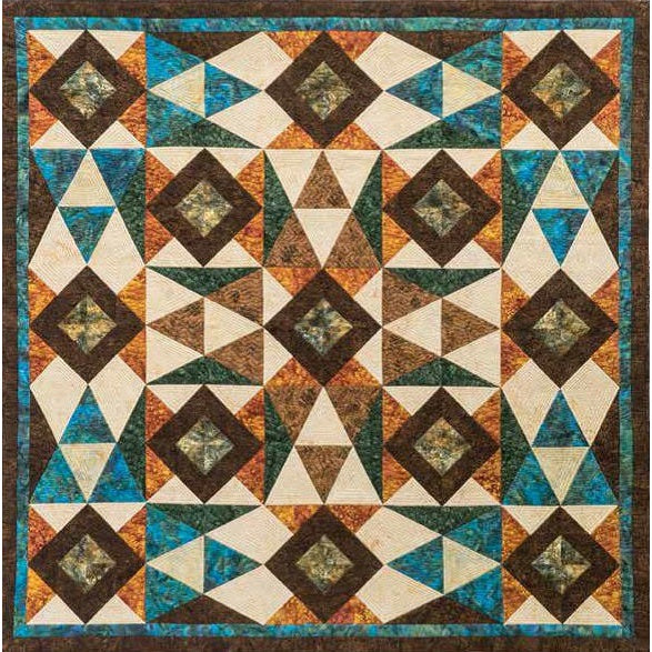 A colorful geometric quilt featuring diamond and triangle patterns in teal, brown, cream, and orange fabrics with a teal border.