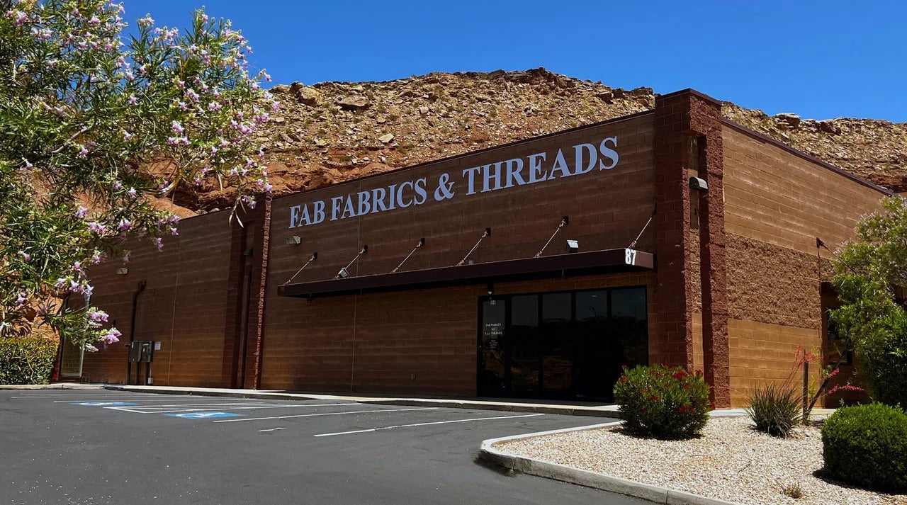 office building showing fab fabrics and threads signage