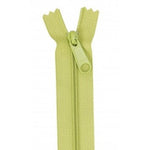 Apple green 24-inch zipper with matching pull tab, shown fully closed against white background.