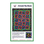 Quilt pattern featuring colorful geometric blocks arranged in a grid with black floral border on green packaging.