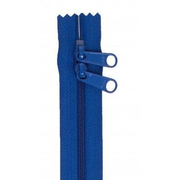 Blue 30-inch zipper with double pull tabs and decorative scalloped edge at the top
