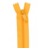 Bright orange zipper with matching pull tab, displayed open against white background.