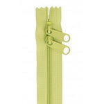 Green 30-inch zipper with two pull tabs and closed-end design.